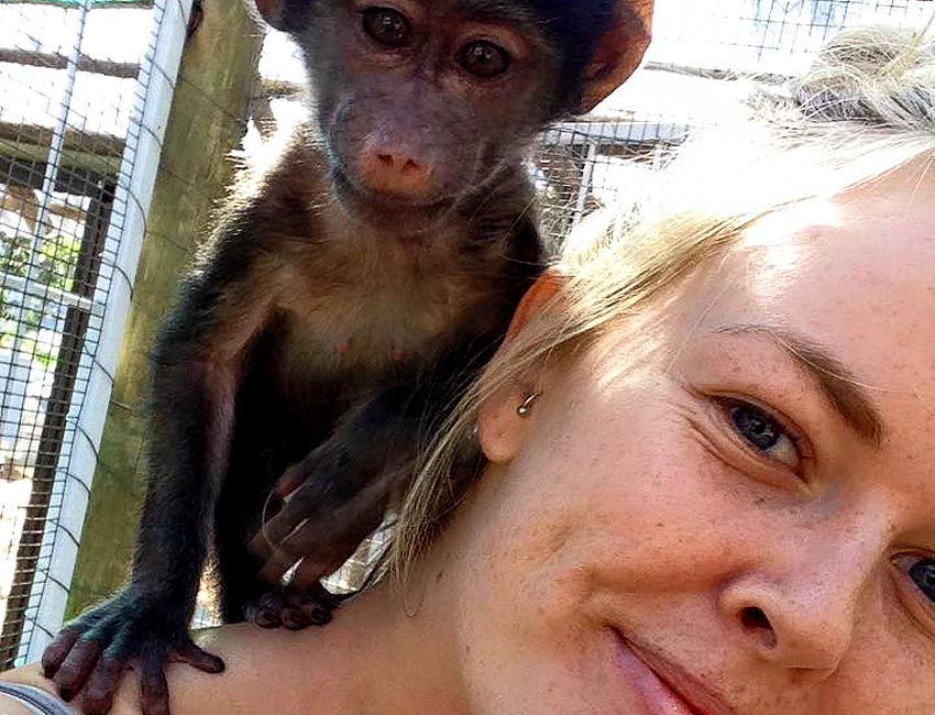 Freckled Girl with Baboon on Shoulder